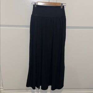 Long black skirt with slit Built in shorts. elastic waist band.